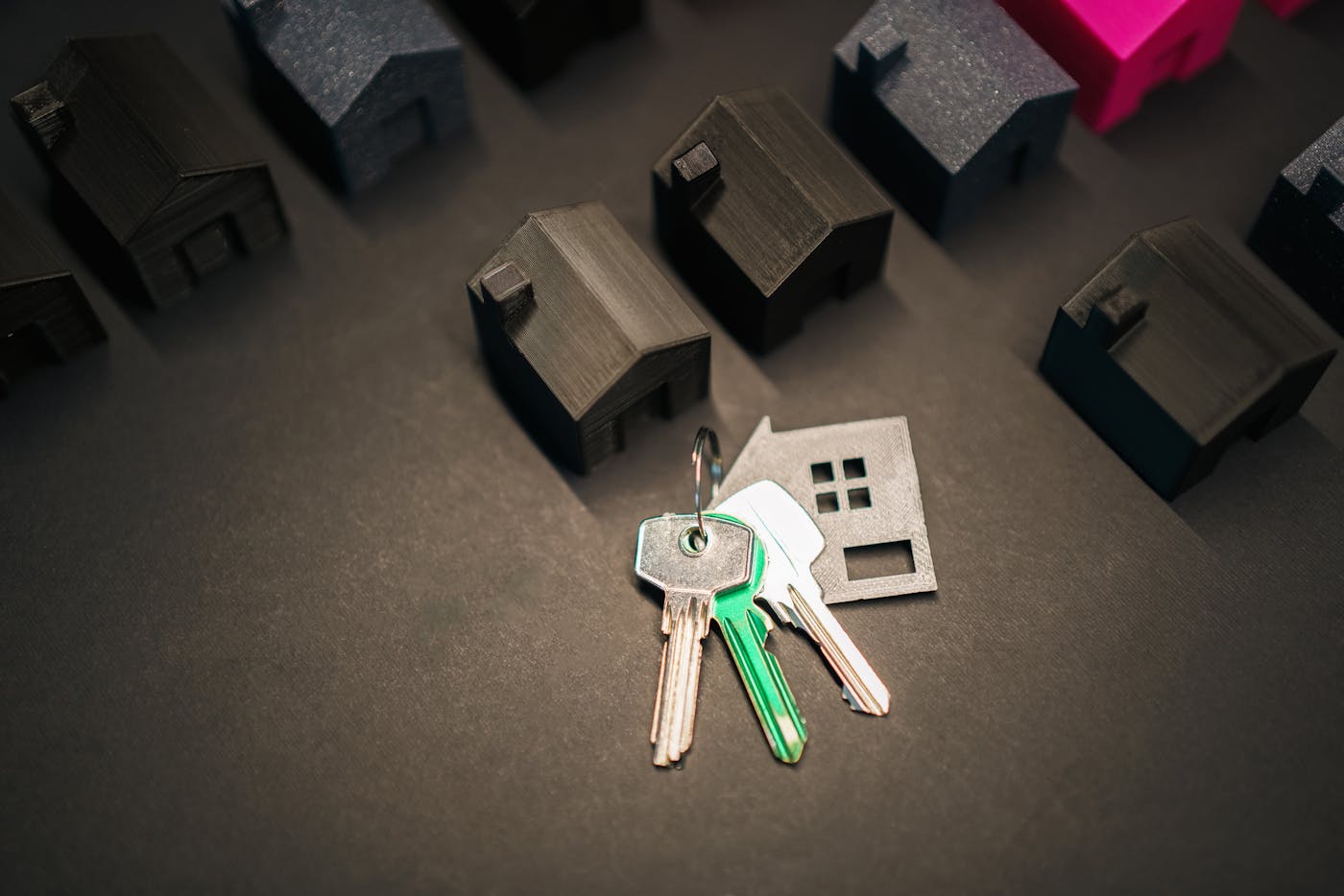 House models and keys representing real estate and property management